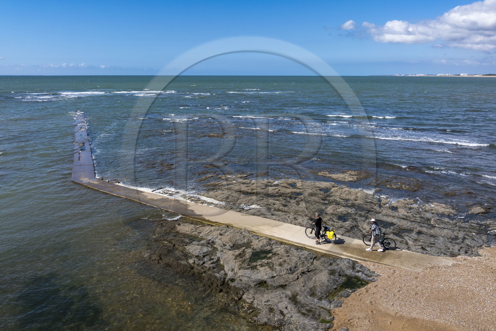 France, Vendée, Saint Hilaire de Riez, cyclists on a pier in Sion-sur-Mer located on the Cote de Lumière (aerial view)