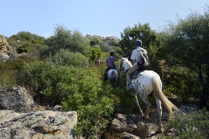France, Haute Corse, Nebbio, riders trekking in the Agriates Desert