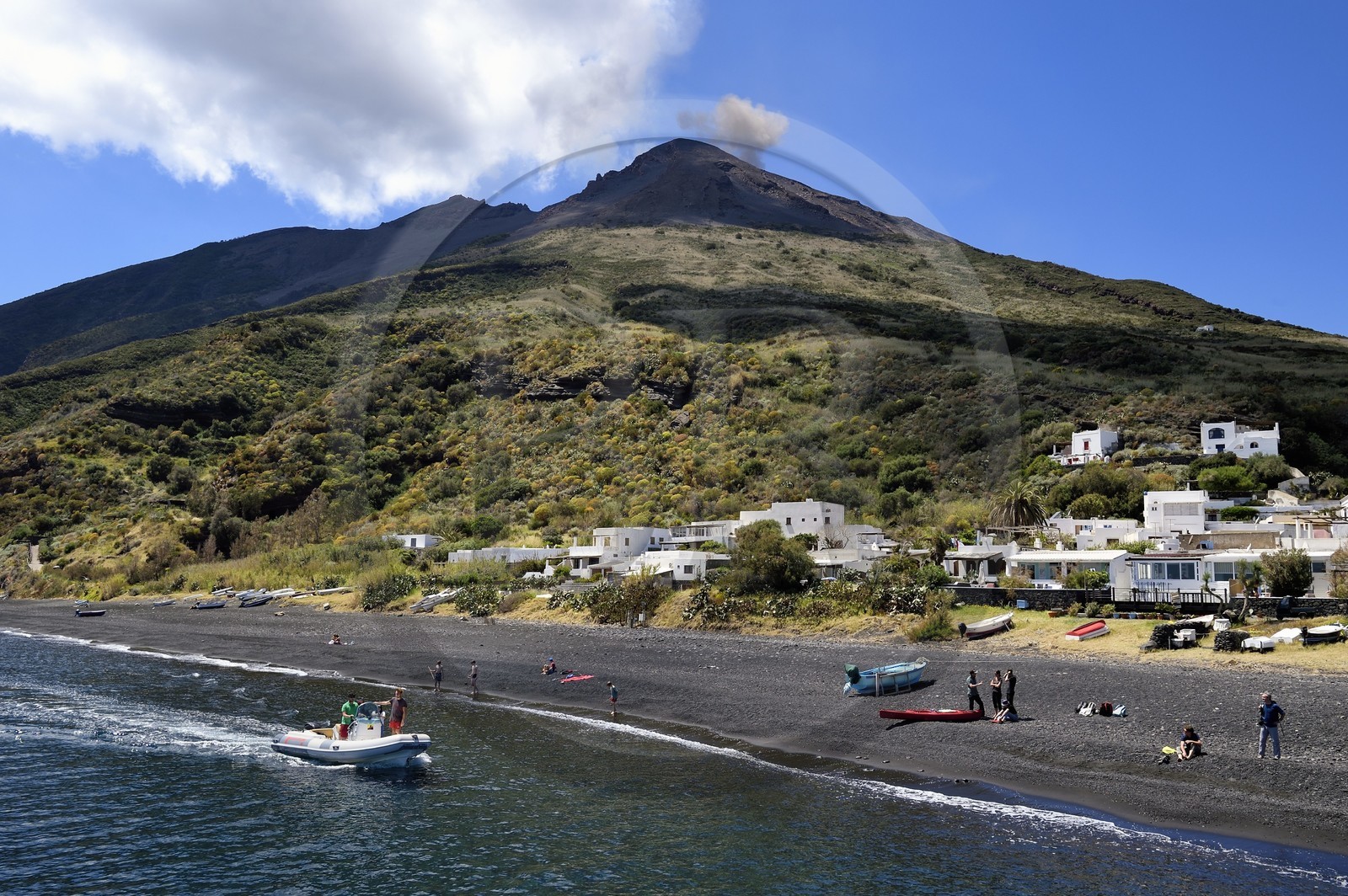 Italy, Sicily, Aeolian Islands, listed as World Heritage by UNESCO, Stromboli island, one of the multiple and regular eruptions of the Stromboli volcano which rises to 924m, the beach of Scari in the foreground