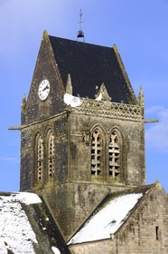 France, Manche, Cotentin, parachutist's dummy hanging on the church's bell tower of Sainte Mere Eglise