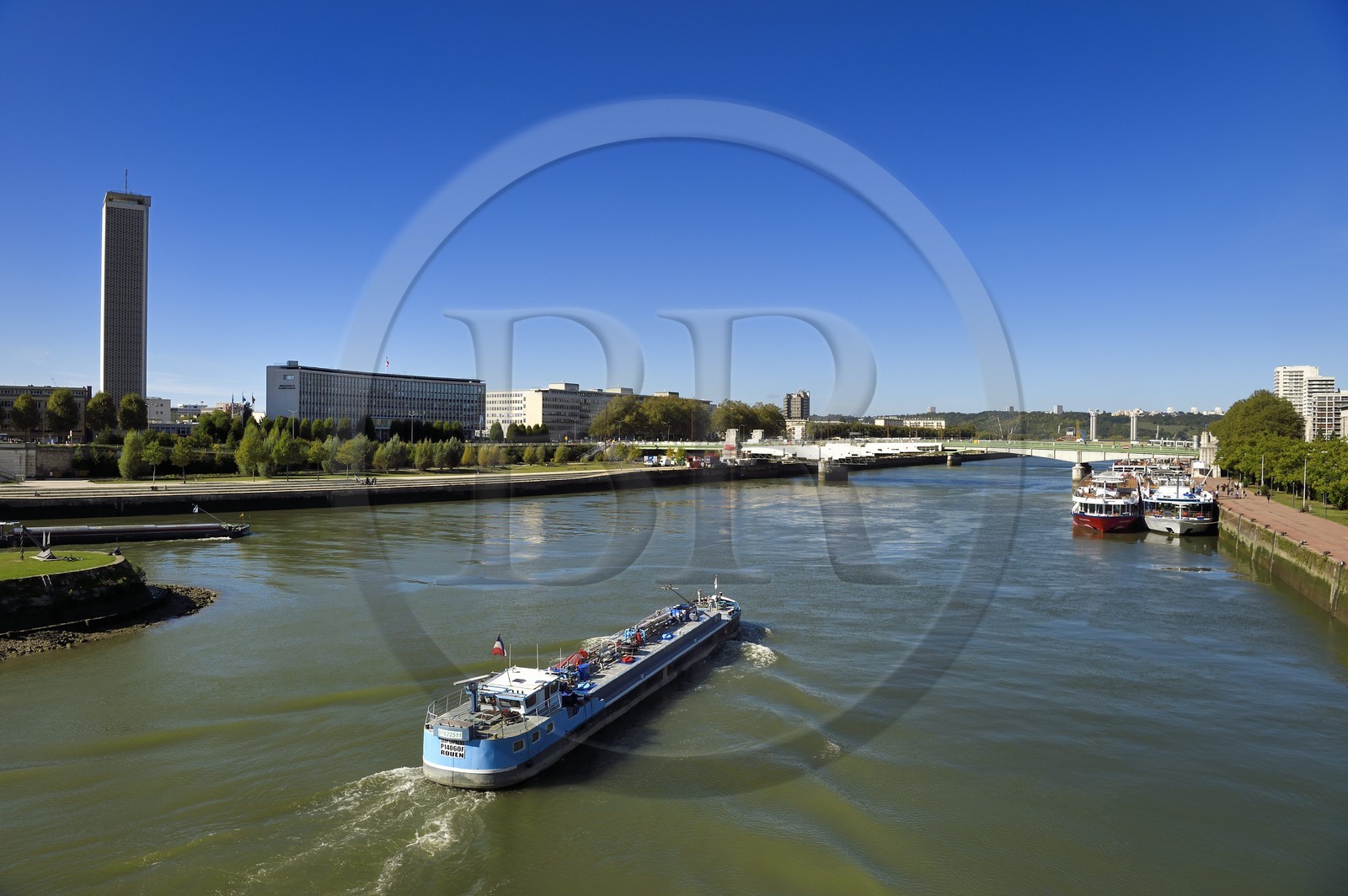 France, Seine Maritime, Rouen, barge on the Seine and the Boieldieu Bridge, the departmental archives tower of Seine-Maritime in the background