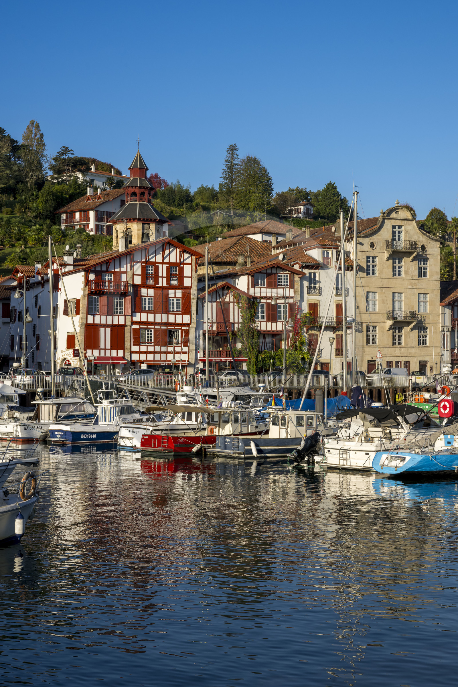 France, Pyrenees Atlantiques, Basque Country coast, Ciboure, the birthplace of Maurice Ravel (in stone) and the bell tower of the Saint-Vincent church on the edge of the port