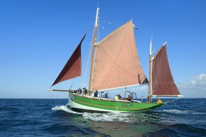 France, Cotes-d'Armor, Perros-Guirec, Sept-Iles Archipelago and bird sanctuary, Rouzic island, the traditional sailboat Sant C'hireg (Saint Guirec)