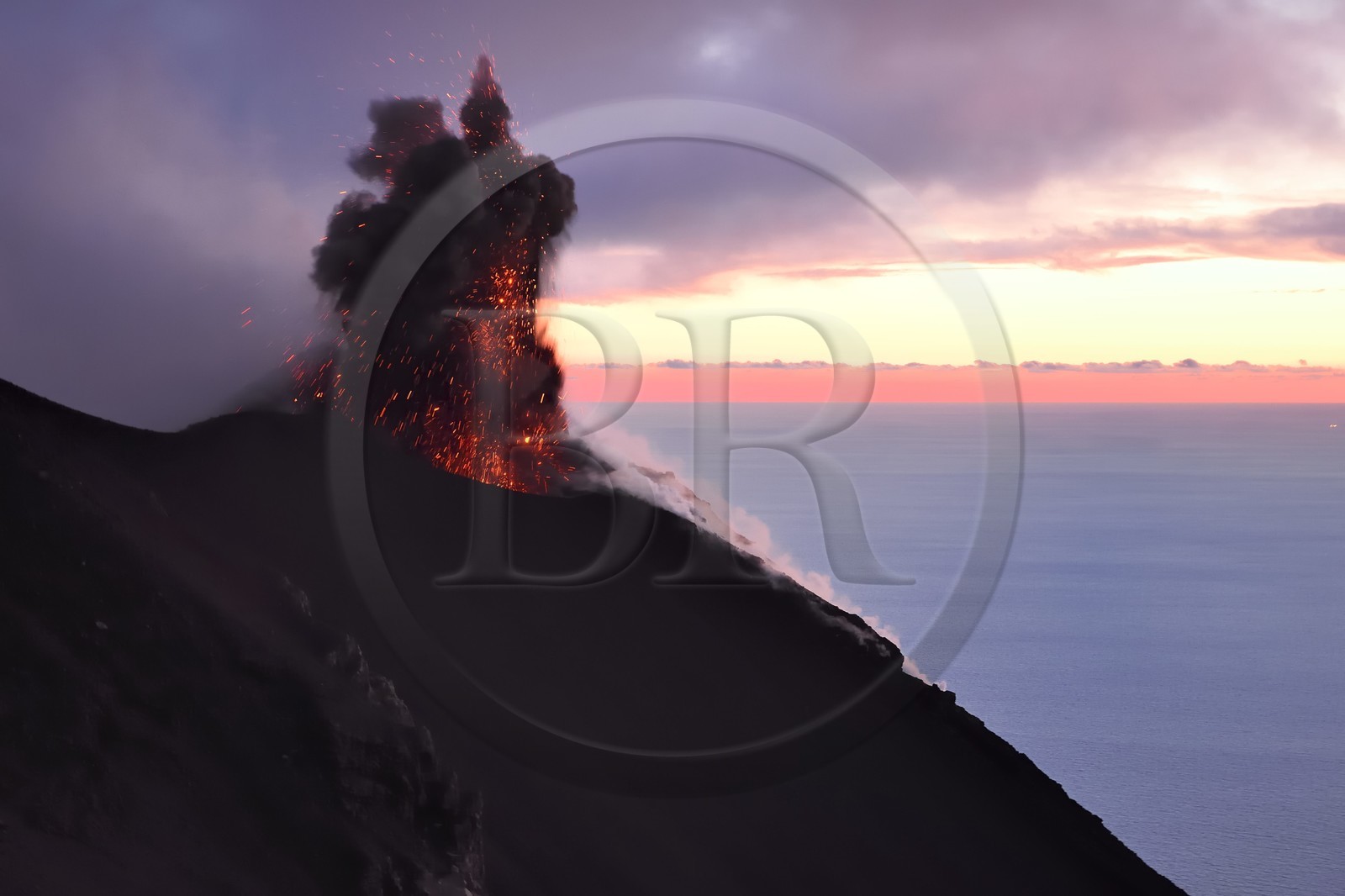 Italy, Sicily, Aeolian Islands, listed as World Heritage by UNESCO, Stromboli island, eruption and projection of lava bombs on the slopes of the active volcano at sunset