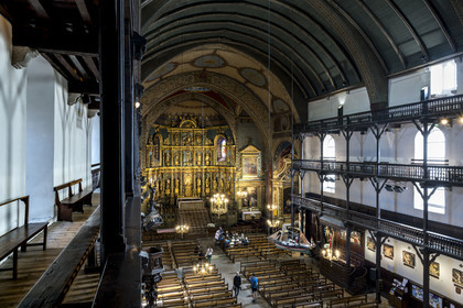 France, Pyrenees Atlantiques, Basque Country, Saint Jean de Luz, the Saint-Jean-Baptiste (Saint John the Baptist) Church, 17th century altarpiece in gilded wood and the wooden galleries of the nave