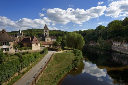 France, Dordogne, Perigord Noir, Vezere Valley, Saint Leon sur Vezere, labelled Les Plus Beaux Villages de France (The Most Beautiful Villages of France), the village on the banks of the Vezere river and the Clerans castle in the background left
