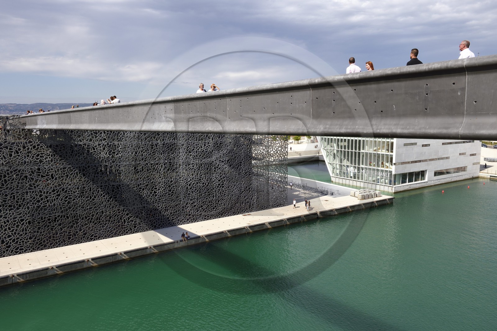 France, Bouches du Rhone, Marseille, bridge to the MuCEM (Museum of Civilizations of Europe and the Mediterranean) by architects Rudy Ricciotti and R. Carta and La Villa Méditerranée by architect Stefano Boeri in background