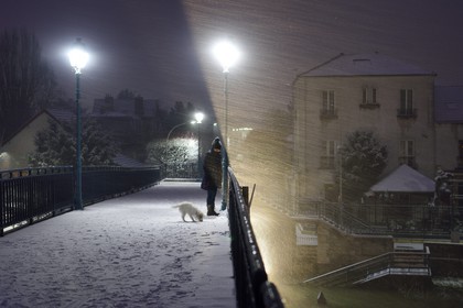 France, Val de Marne, the Marne riverside, Bry sur Marne, the footbridge made by Gustave Eiffel between Bry-sur-Marne and Le Perreux-sur-Marne in the background under a snowstorm