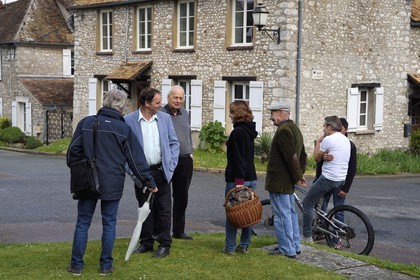 France, Yvelines, Montchauvet, Mayor Georges Duval (in blue jacket) with his citizens on place de l'église
