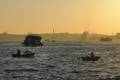 Turkey, Istanbul, fishermen boats on the Bosphorus Strait, the Golden Horn Strait in the background