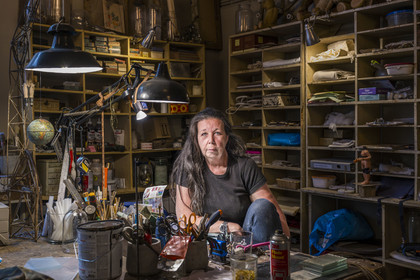 France, Vaucluse, Avignon, Interior designer Pascale Palun in her Vox Populi workshop-boutique, specializing in the creation of lighting and decorative objects