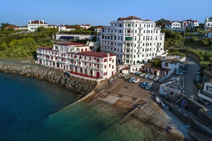 France, Pyrenees Atlantiques, Basque Country coast, Guethary, old whaling port overlooked by the former art deco Guétharia hotel built in the 1920s turned into a residence (aerial view)