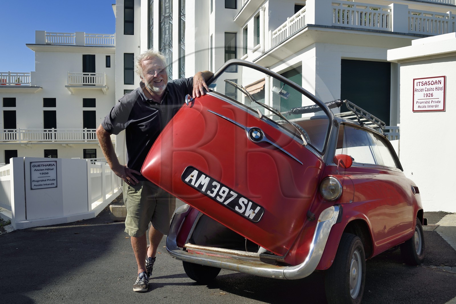 France, Pyrenees Atlantiques, Basque Country coast, Guethary, former art deco Guétharia hotel built in the 1920s turned into a residence, French journalist, writer and director Alain Gardinier driving his BMW Isetta