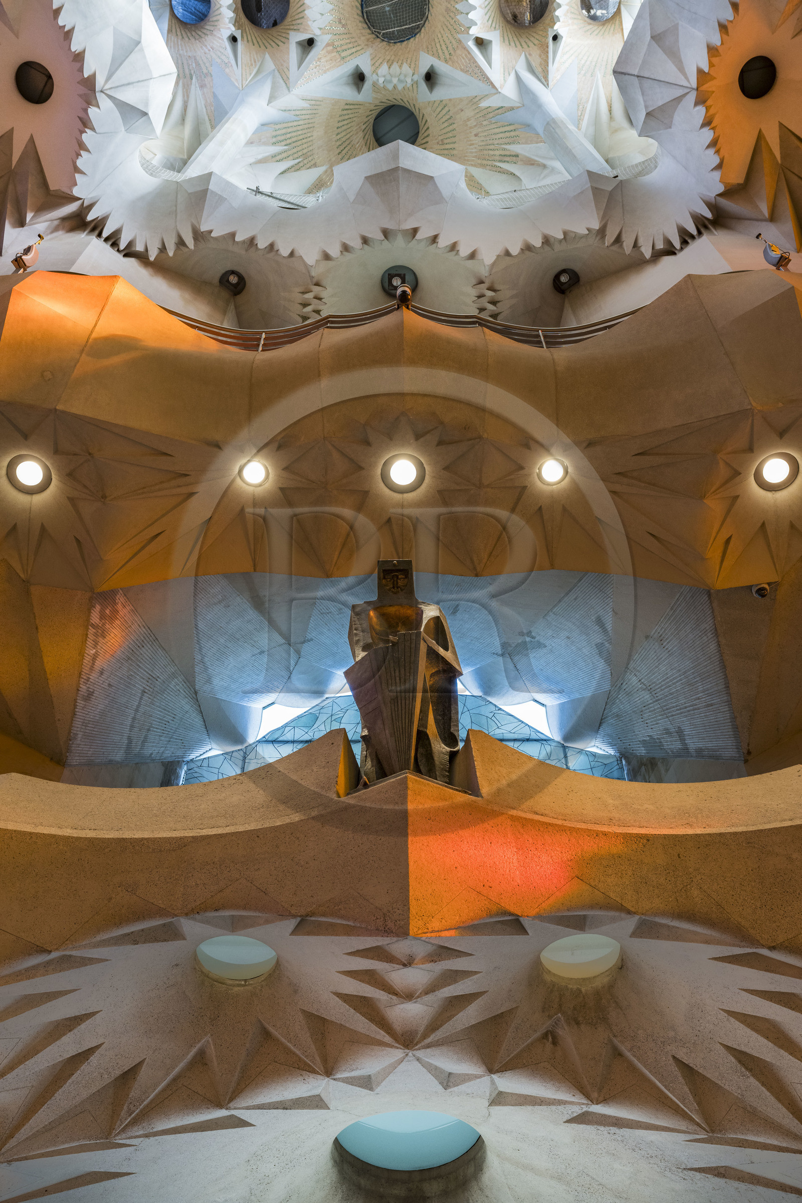 Spain, Catalonia, Barcelona, Eixample district, Sagrada Familia basilica by Catalan modernist architect Antoni Gaudi, listed as a UNESCO World Heritage Site, the bronze statue of Saint George (Sant Jordi) by the sculptor Subirachs in the center of the interior of the facade of Glory and the vault of the Nave at the top