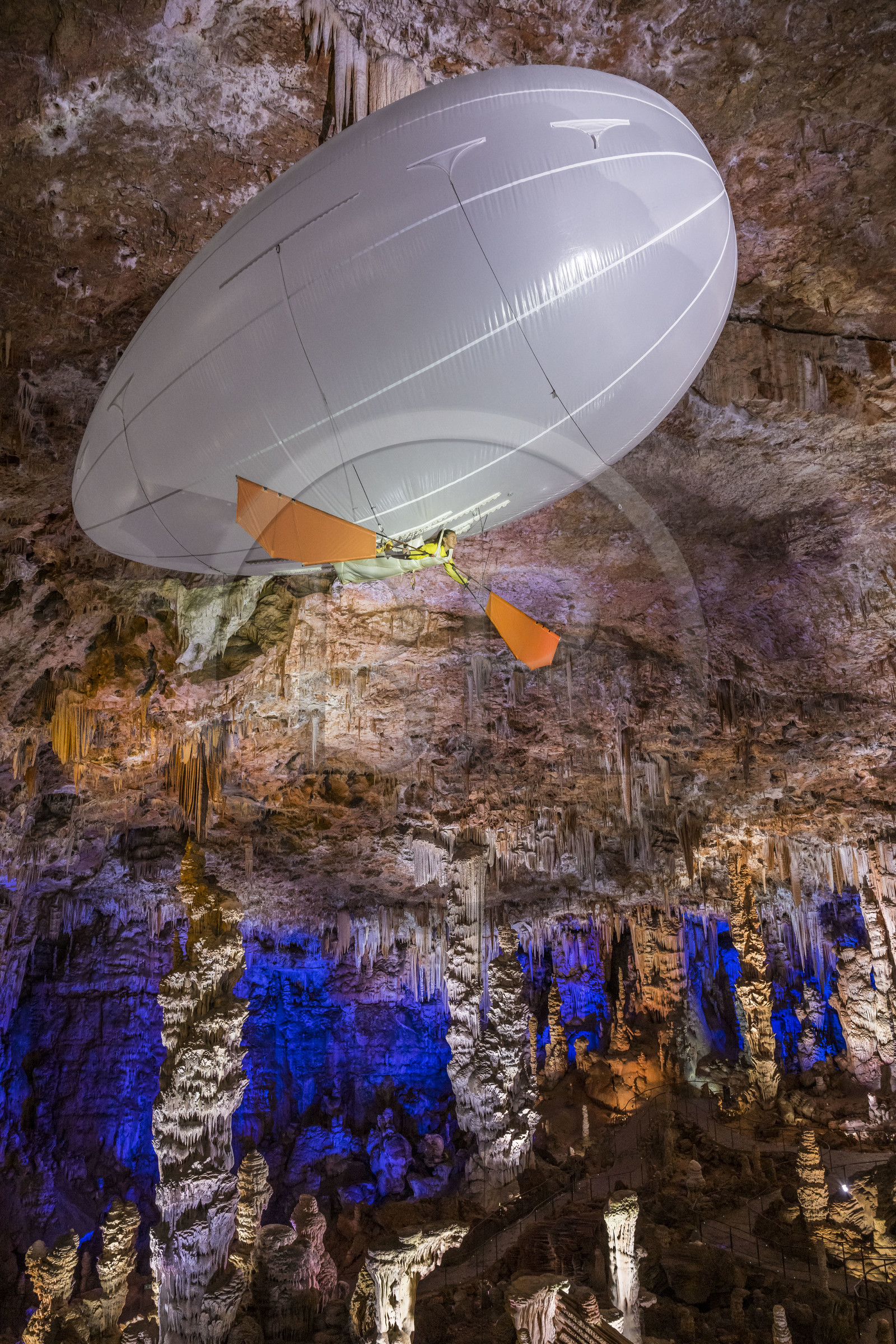 France, Gard, Mejannes-le-Clap, grotte de La Salamandre (Salamander cave), discovery of the cave in Aéroplume®, an individual dirigible balloon inflated with helium which allows you to fly away by flapping your wings