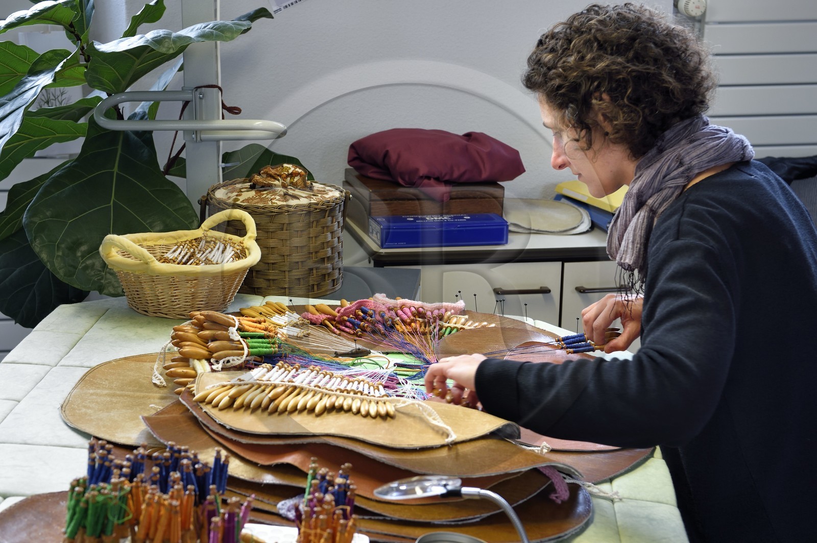France, Haute Loire, Le Puy en Velay, National conservatory workshop of Puy lace (Atelier conservatoire national de la dentelle du Puy), bobbin lace on artists' creations commissioned by the national furniture department, lace maker on a traditional tile