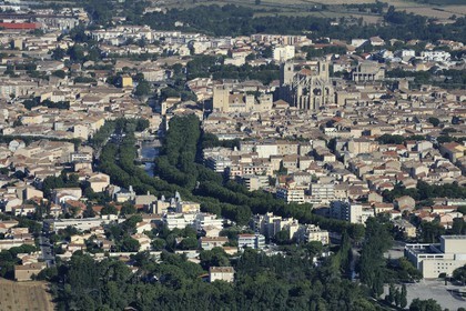 France, Aude, Narbonne, the archbishop palace adjoining the cathedral Saint-Just-et-Saint-Pasteur and the Canal de la Robine (aerial view)