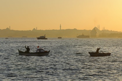Turkey, Istanbul, fishermen boats on the Bosphorus Strait, the Golden Horn Strait in the background