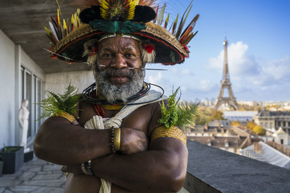 France, Paris, UNESCO Headquarters, Papuan Chief Mundiya Kepanga and the Eiffel Tower in the background
