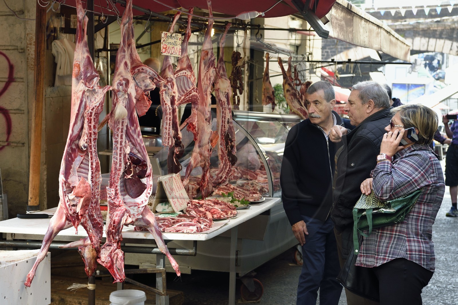 Italy, Sicily, Catania, Baroque city listed as UNESCO World Heritage, the Pescheria morning market in the Duomo district, meat sale