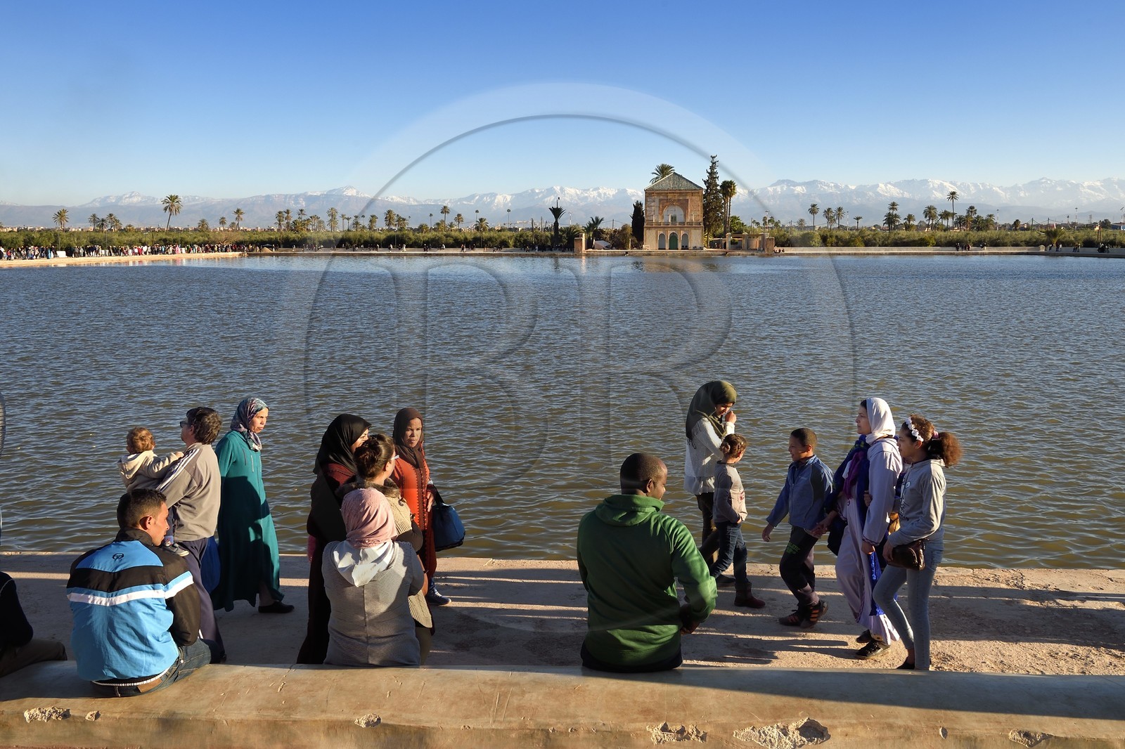 Morocco, High Atlas, Marrakech, Imperial city, Medina listed as World Heritage by UNESCO, La Menara listed as World Heritage by UNESCO, Saadian Pavilion and pool in the gardens, the snow-covered Atlas in the background