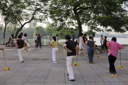 Vietnam, Hanoi, old town, Hoan Kiem Lake also called the small lake or Lake of the Restored Sword, people doing Tai chi