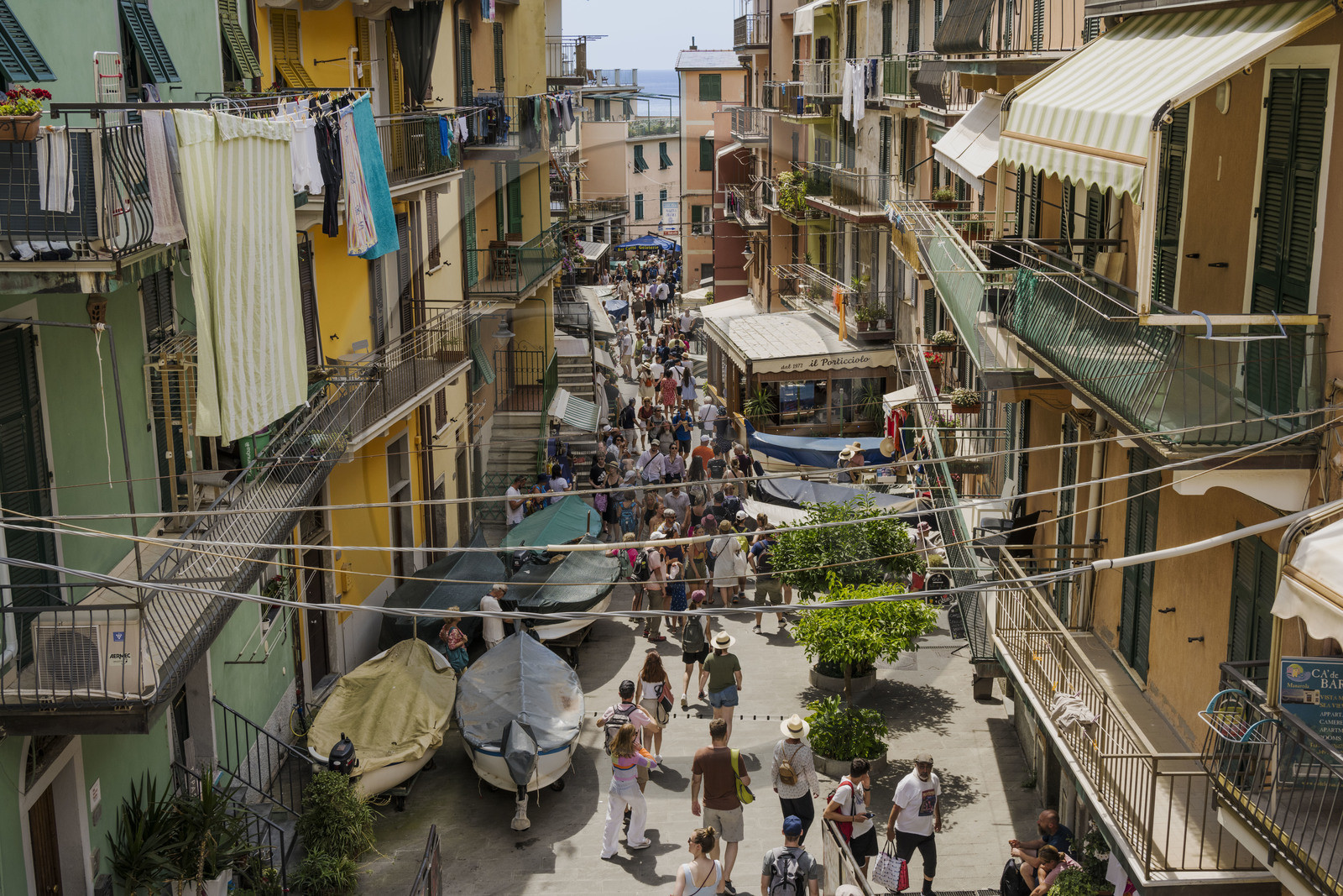 Italy, Liguria, Cinque Terre National Park listed as World Heritage by UNESCO, village of Manarola, the fishing boats went up to the main street for lack of free space