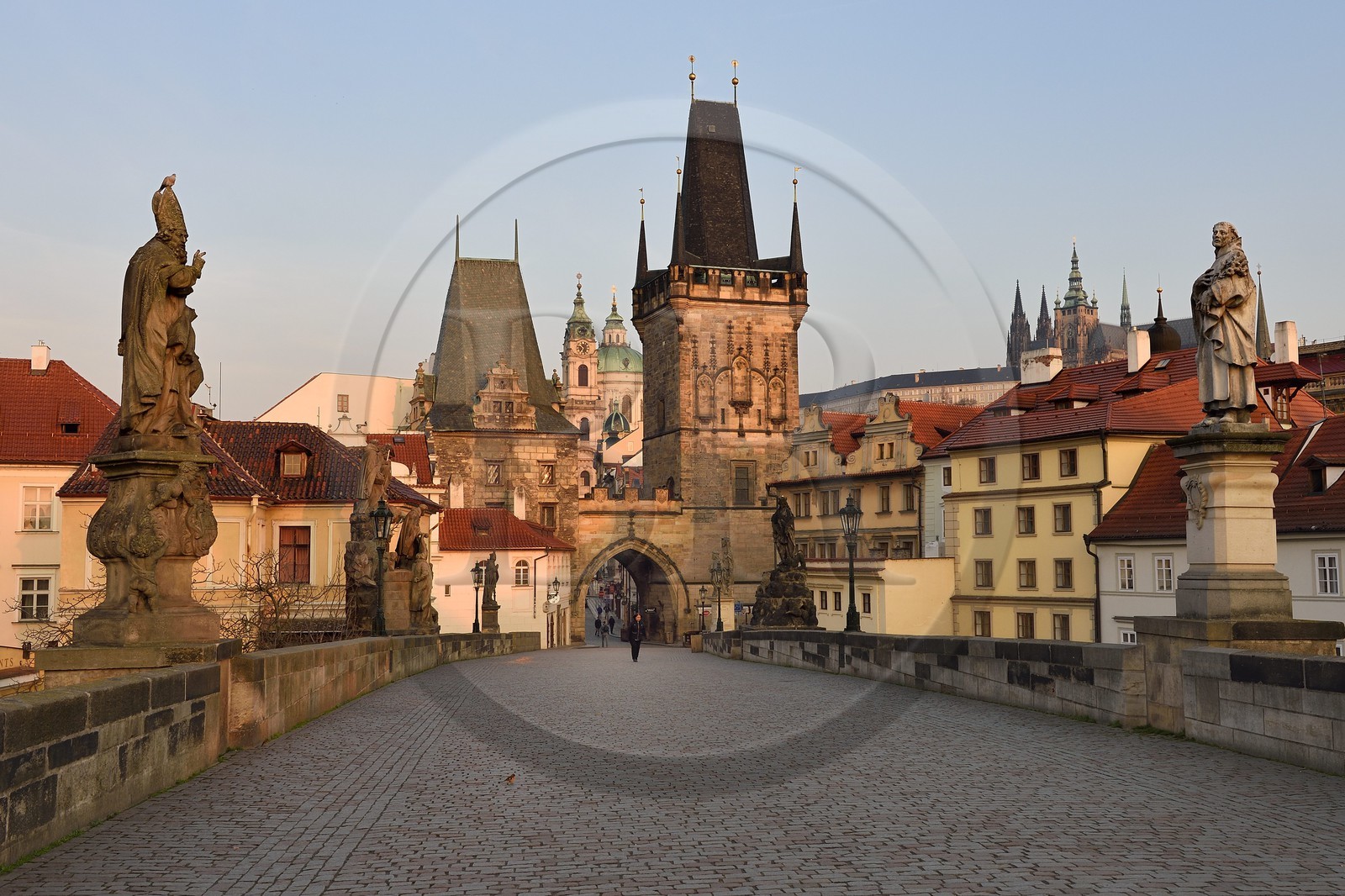 Czech Republic, Prague, historical centre listed as World Heritage by UNESCO, the Charles Bridge over Vltava River, the Gothic tower at the entrance of the bridge on the side of Mala Strana district in front of Saint Nicolas Church and the Royal castle in the background right