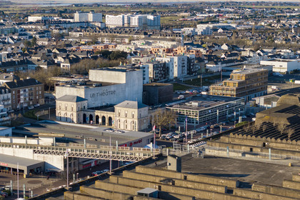 France, Loire-Atlantique, Saint-Nazaire, the Simone-Veil Theatre, national stage, designed by Karine Herman of the K-architectures agency in the city's bombed-out former train station, the roof of the submarine base in the foreground (aerial view)