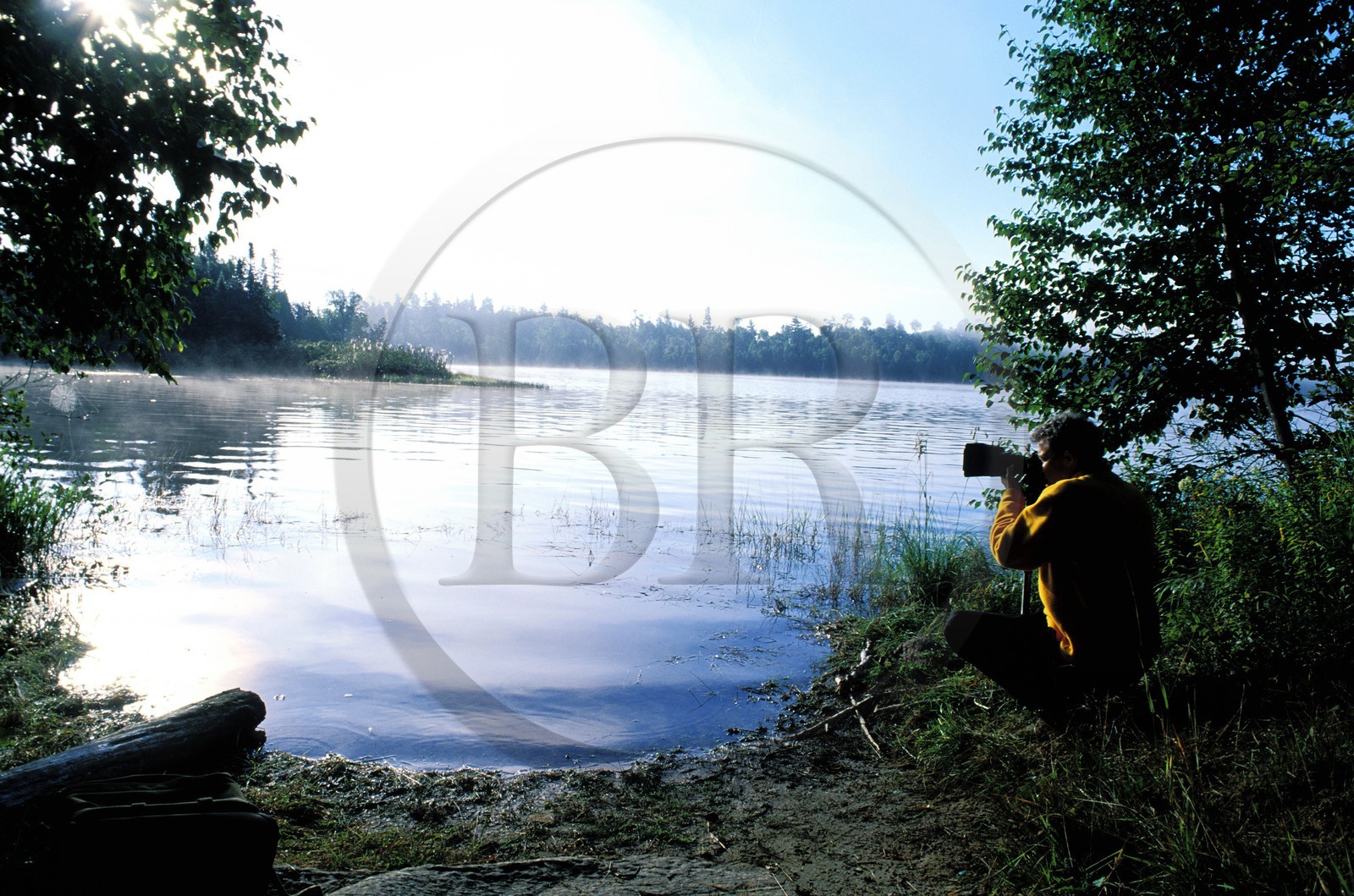 Canada, Quebec Province, La Verendrye Wildlife Reserve, Lake Victoria, a photographer in the early morning