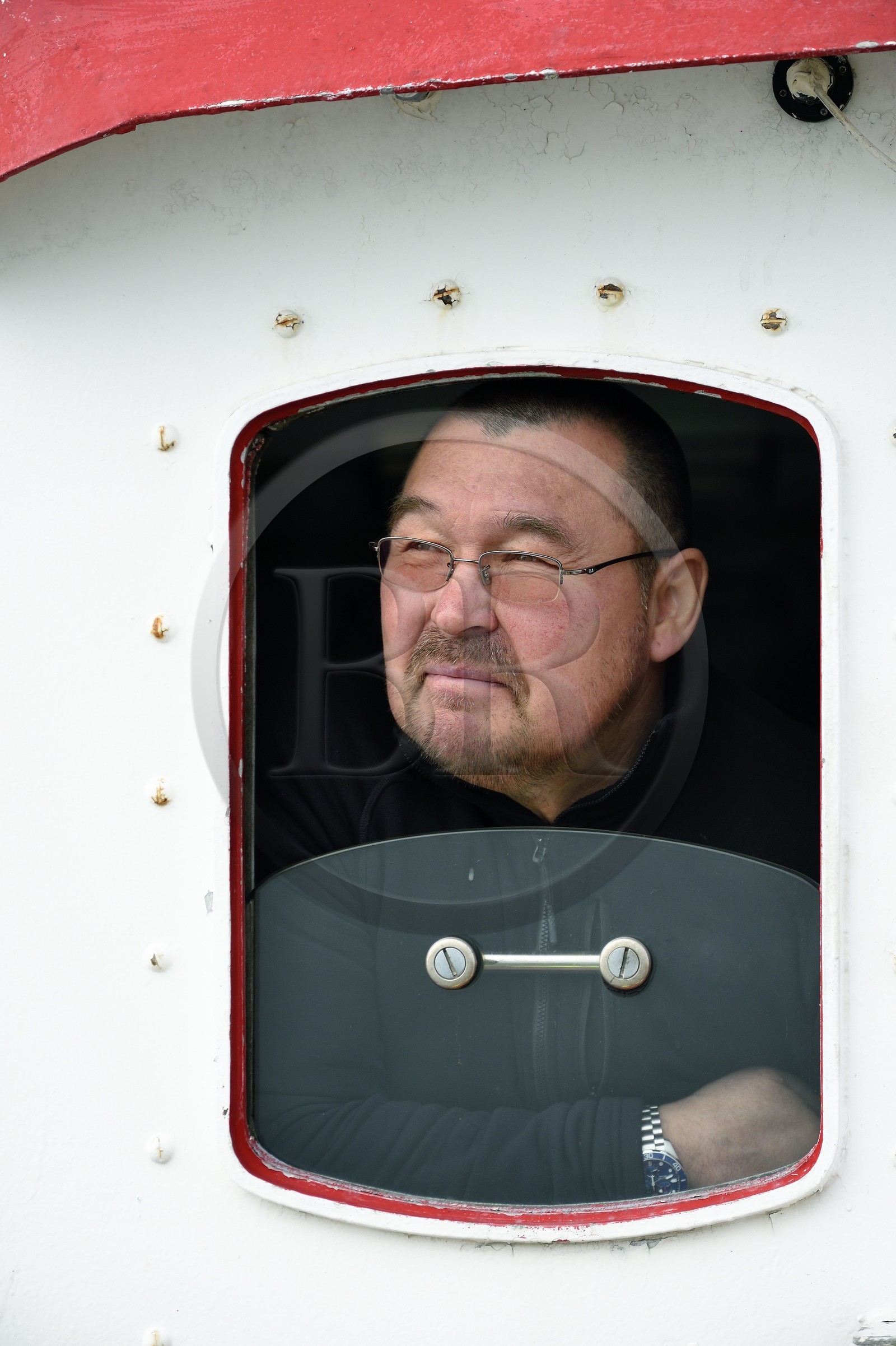 Groenland, cote ouest, baie de Disko, Ilulissat, fjord glacé classé Patrimoine Mondial de l'UNESCO qui est est l’embouchure maritime du glacier Sermeq Kujalleq, capitaine inuit d'un ancien bateau de pêche reconverti pour la découverte des icebergs et l'observation des baleines