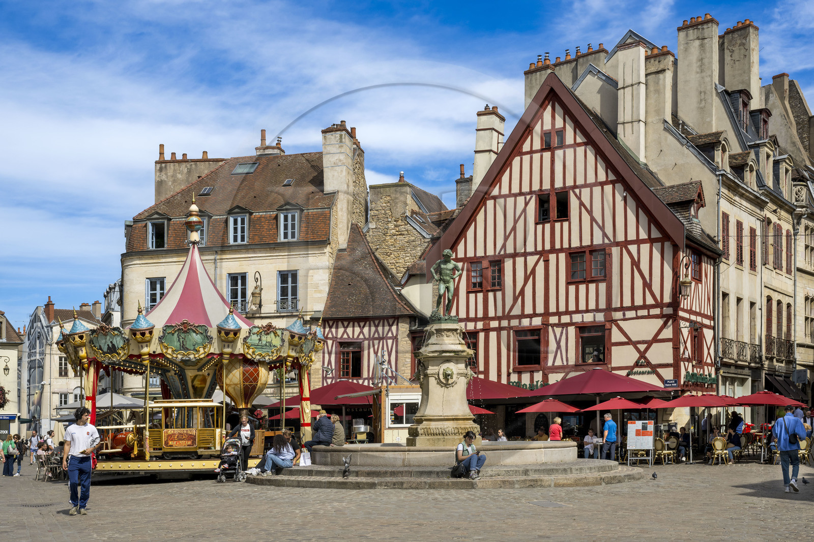 France, Cote d'Or, Dijon, area listed as World Heritage by UNESCO, Bareuzai fountain topped with the bronze sculpture The Harvester Treading the Grapes