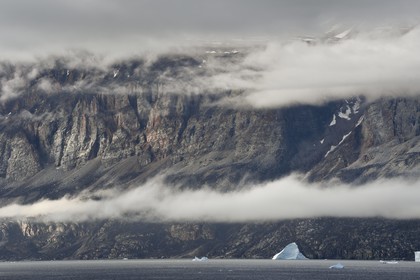 Greenland, west coast, Baffin bay, icebergs under the cliffs of Uummannaq fjord