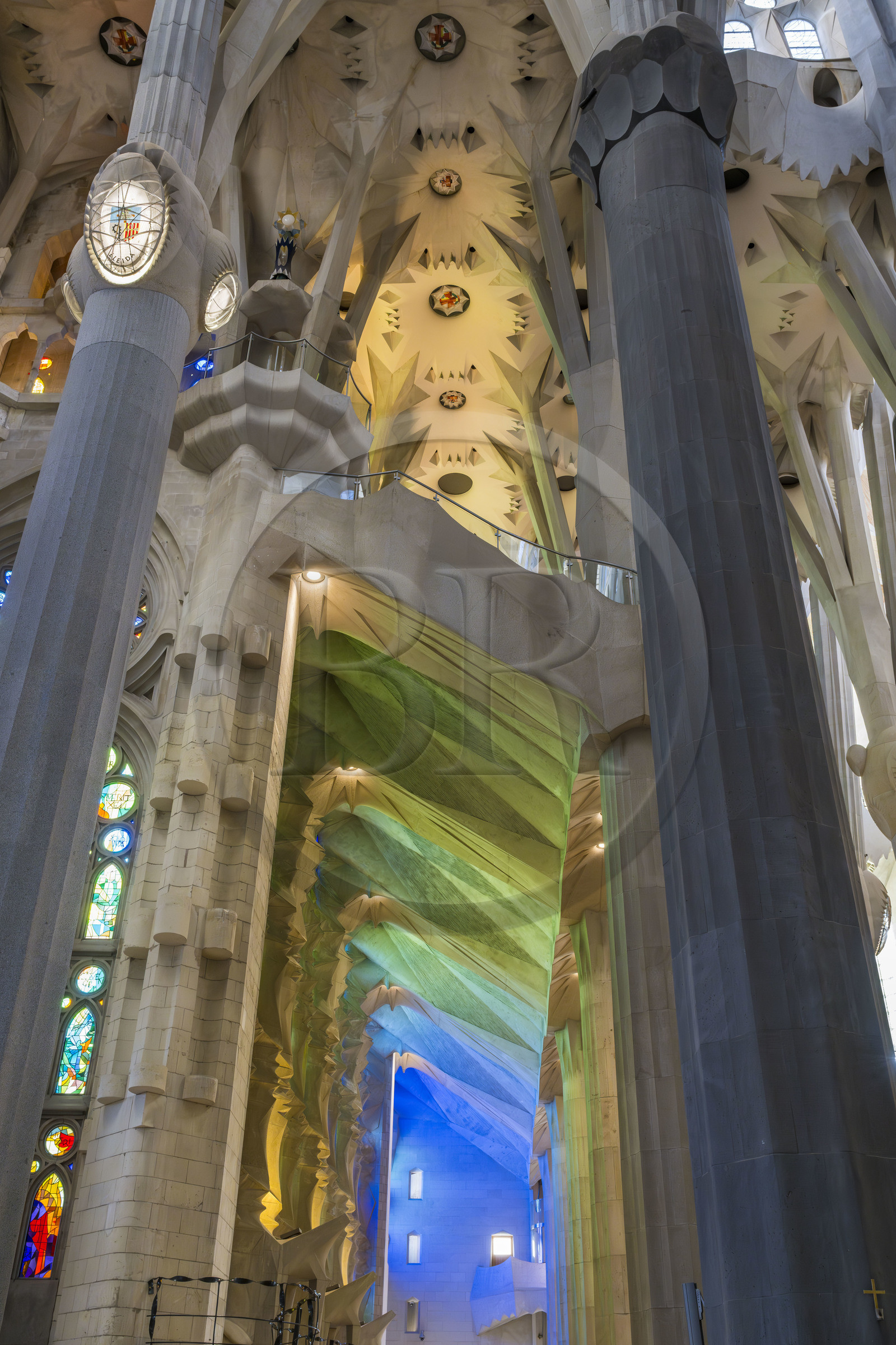Spain, Catalonia, Barcelona, Eixample district, Sagrada Familia basilica by Catalan modernist architect Antoni Gaudi, listed as a UNESCO World Heritage Site, the cold colours created by the stained glass windows on the Nativity facade by the Catalan painter and glassmaker Joan Vila-Grau