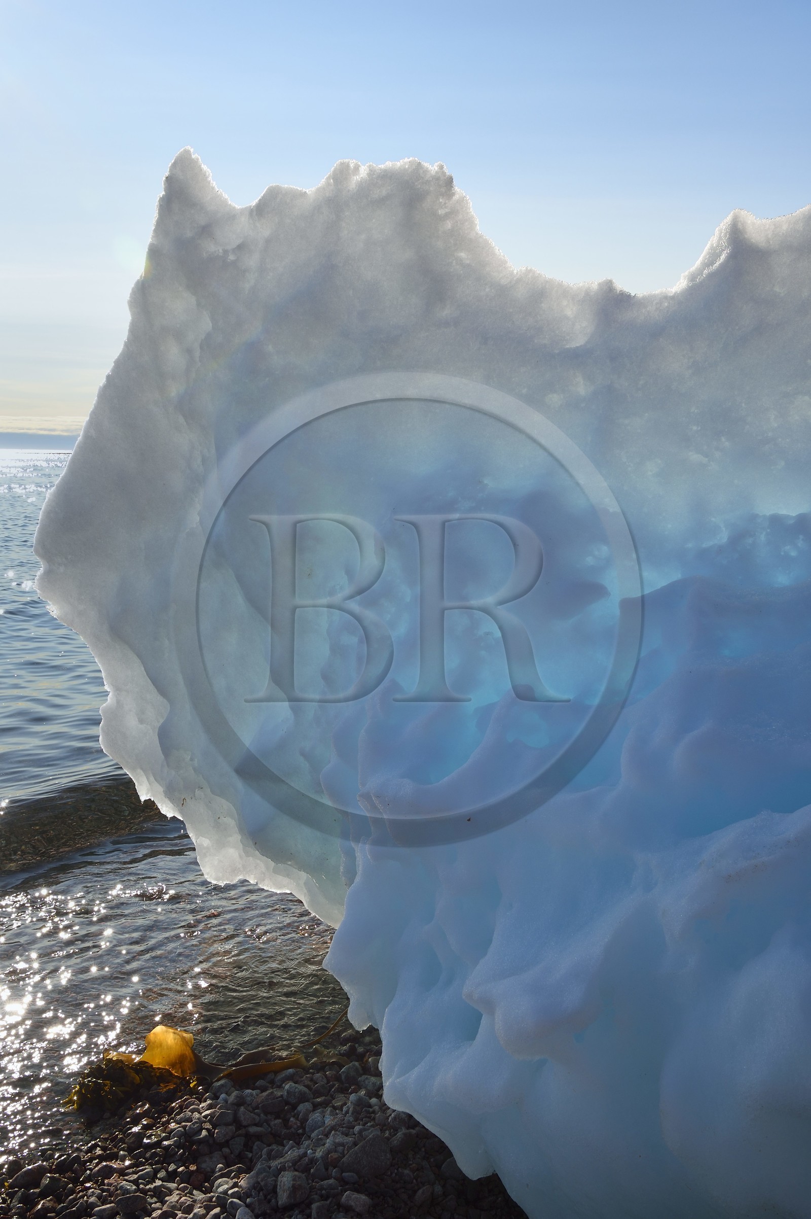 Greenland, North West coast, Smith sound north of Baffin Bay, Inglefield Land, site of Etah in Foulke fjord, today abandoned Inuit camp that served as a base for several polar expeditions, little icebeg on the beach