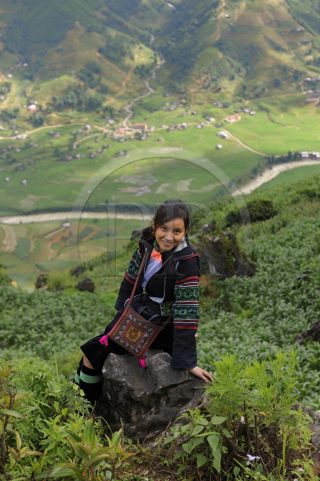 Vietnam, Lao Cai province, Sapa district, young woman from the Black Hmong minority group overlooking her valley Hau Thao