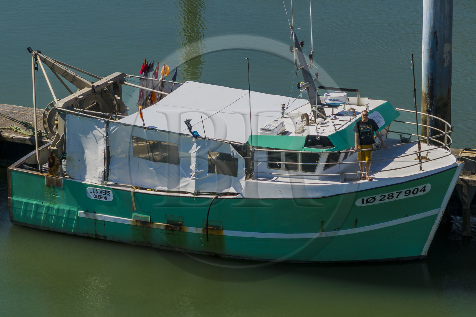France, Charente Maritime, Oleron island, port of La Cotinière, flood basin built in 2022 at the foot of the new fish market, fisherman Yoann Crochet on his trawler L'Univers intended for artisanal coastal fishing (aerial view)