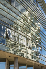France, Herault, Montpellier, the L'Arbre Blanc building by Japanese architect Sou Fujimoto is reflected in the facade of the Richter University Library by architect René Dottelonde