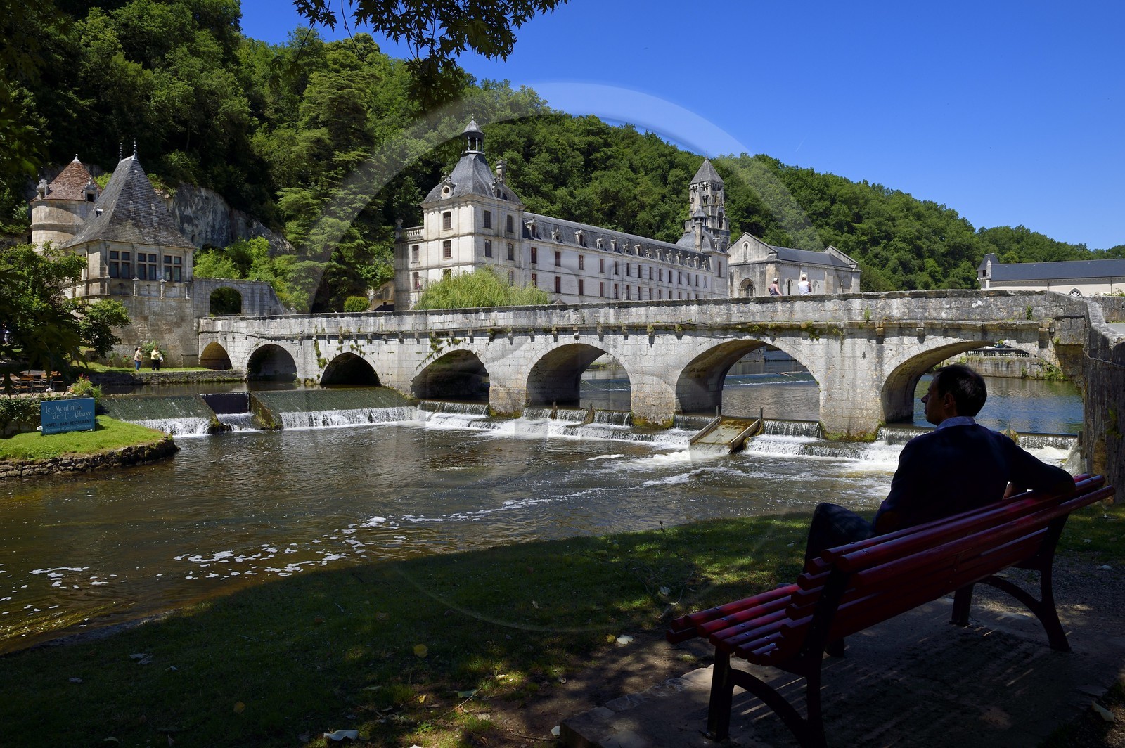 France, Dordogne, Brantome, Pont Coude (angled bridge) over Dronne River and Saint Pierre benedictine abbey