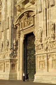Italy, Lombardy, Milan, the Duomo in the historical center, cathedral in Gothic Flamboyant style, central portal surmounted by a tympanum representing the Creation of Eve (drawings by Cerano)