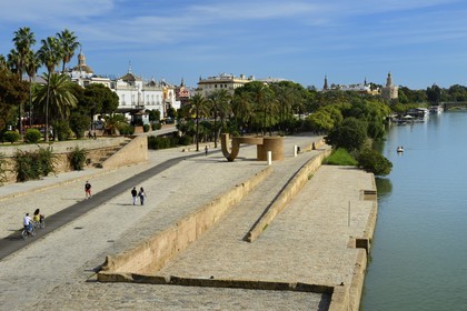 Spain, Andalusia, Seville, Guadalquivir river Banks, the Paseo de Cristobal Colon (Christopher Columbus) and the Golden Tower (Torre del Oro) in the background