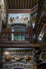 France, Pyrenees Atlantiques, Basque Country coast, Hendaye, Abbadia castle built in 1870 by Eugène Viollet-le-Duc for Antoine d'Abbadie d'Arrast, the Ethiopian paintings of the vestibule and the grand staircase, torchiere lamp statue representing Abdullah former Ethiopian slave freed and dead under the commune of Paris