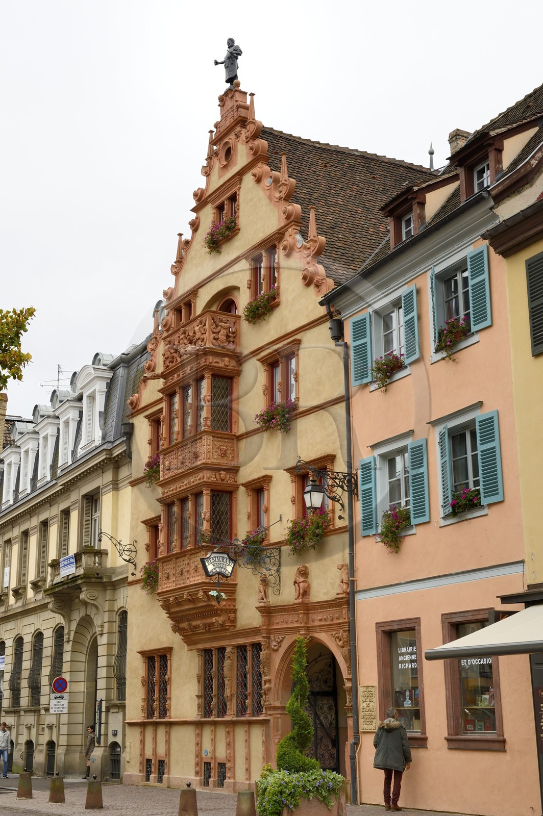 France, Haut Rhin, Colmar, la Maison des Tetes, renaissance style (1609), formerly a wine seller, the tin statue The Alsatian Cooper by Auguste Bartholdi was installed in 1902 at the top of the pinion