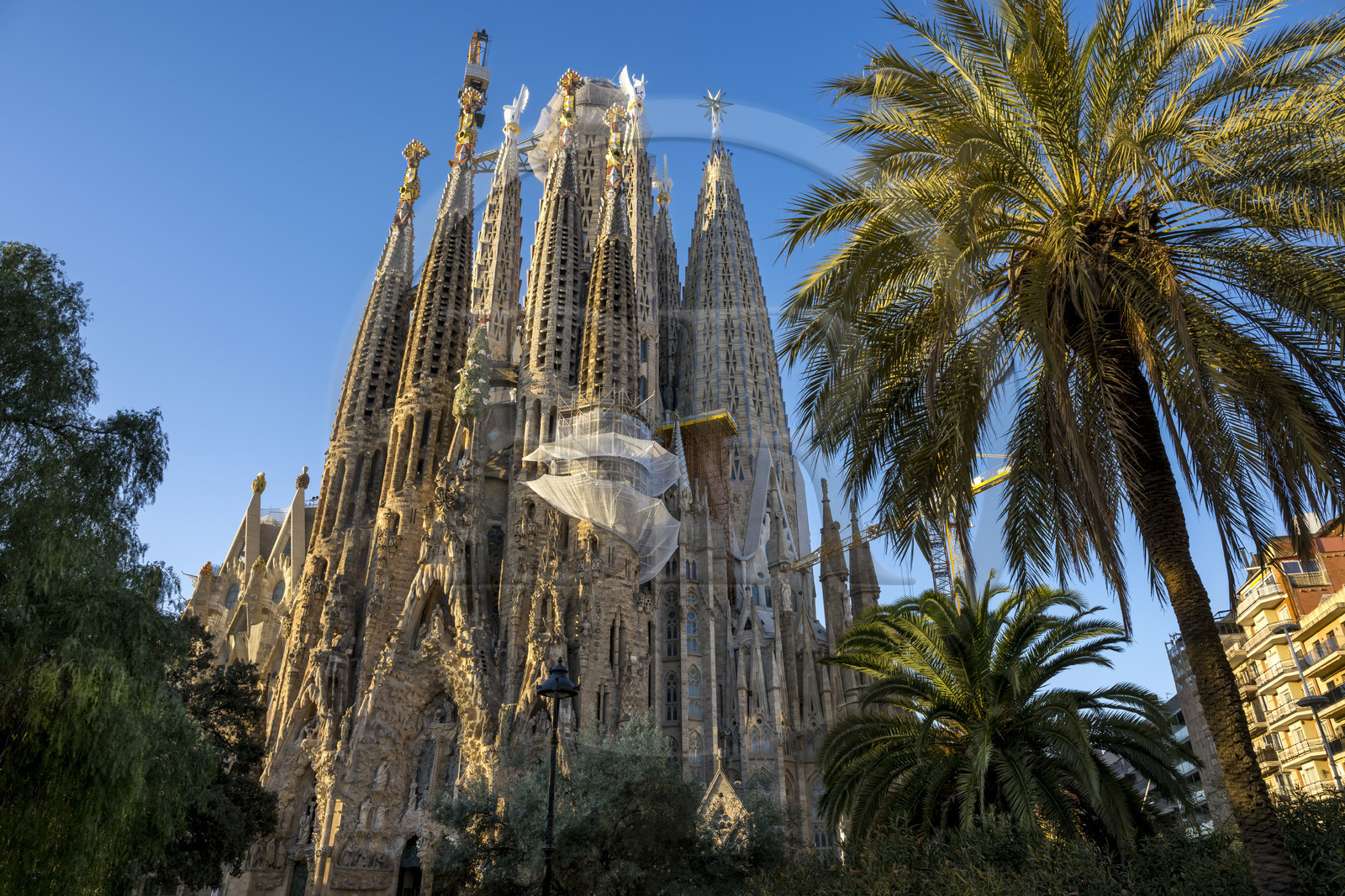 Spain, Catalonia, Barcelona, Eixample district, Sagrada Familia basilica by Catalan modernist architect Antoni Gaudi, listed as a UNESCO World Heritage Site, facade of the Nativity