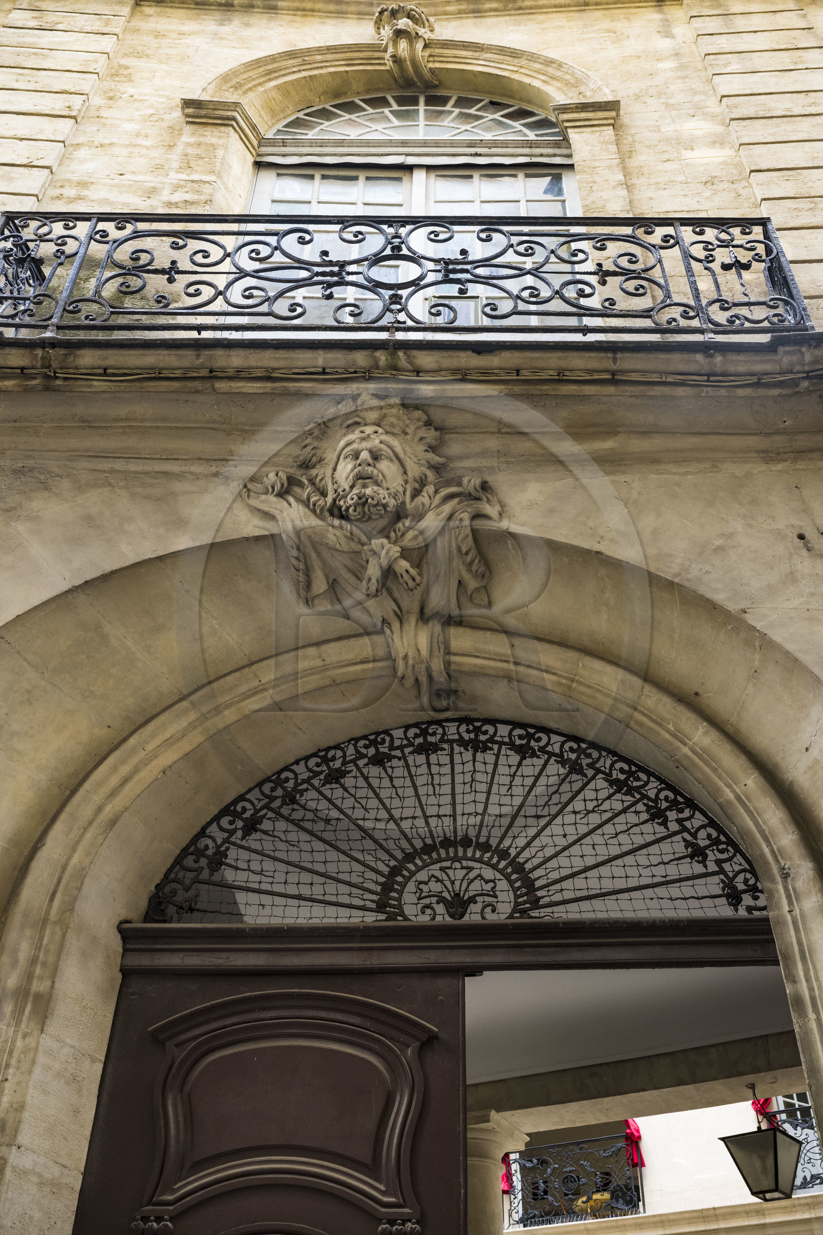 France, Herault, Montpellier, historic center called the Ecusson, mascaron representing Hercules on the facade of the Hotel Baschy du Cayla, an 18th century private mansion