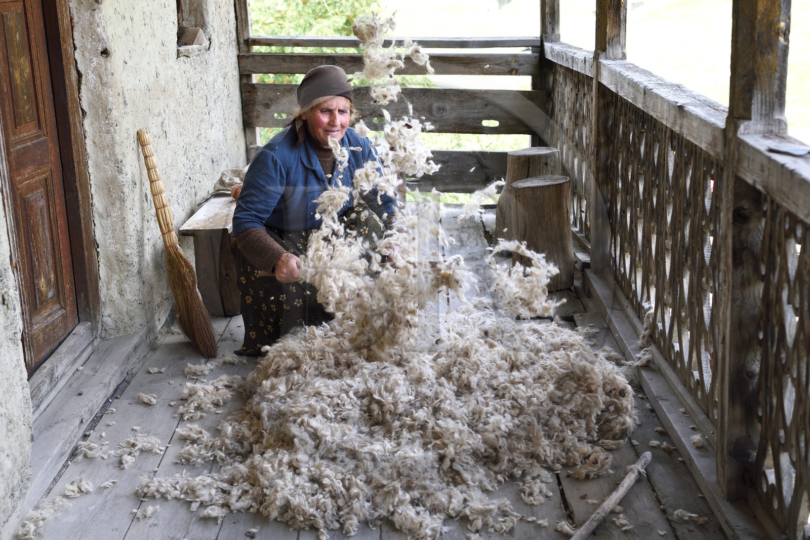 Georgia, Kakheti, Tusheti National Park, village of Shenako, Sirana Hatchizé goes back for the summer in Tusheti, here she airs the wool intended for the mattress