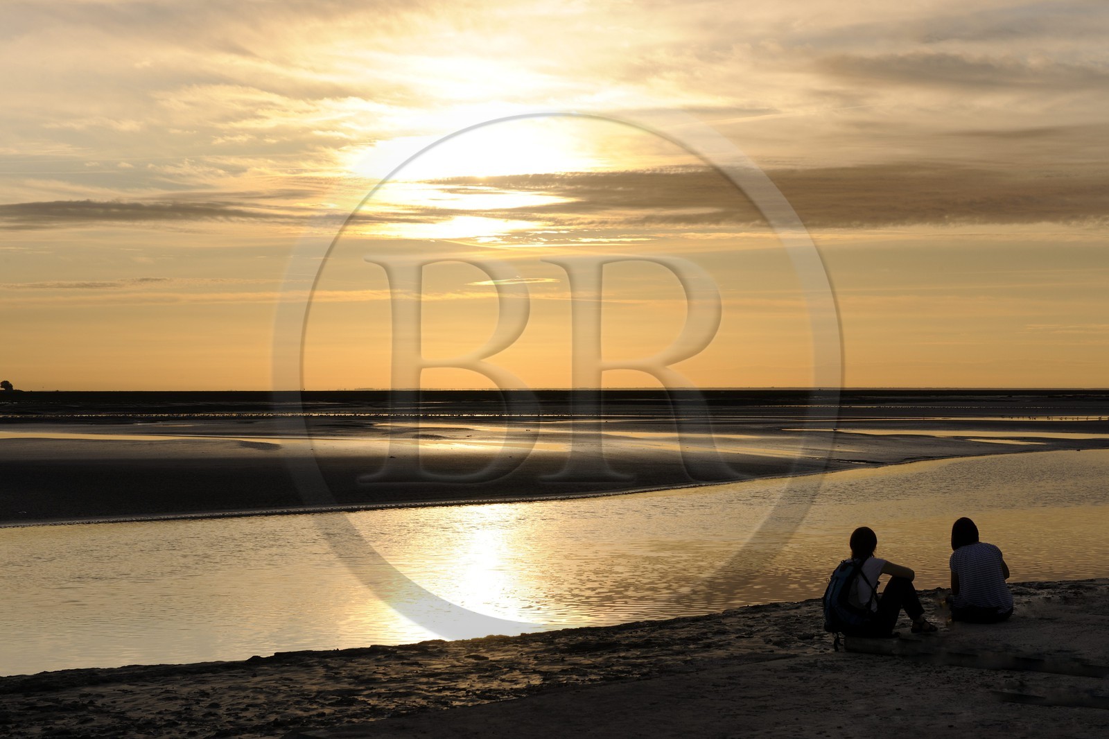 France, Manche, Bay of Mont Saint Michel, intertidal zone of Couesnon River at sunset
