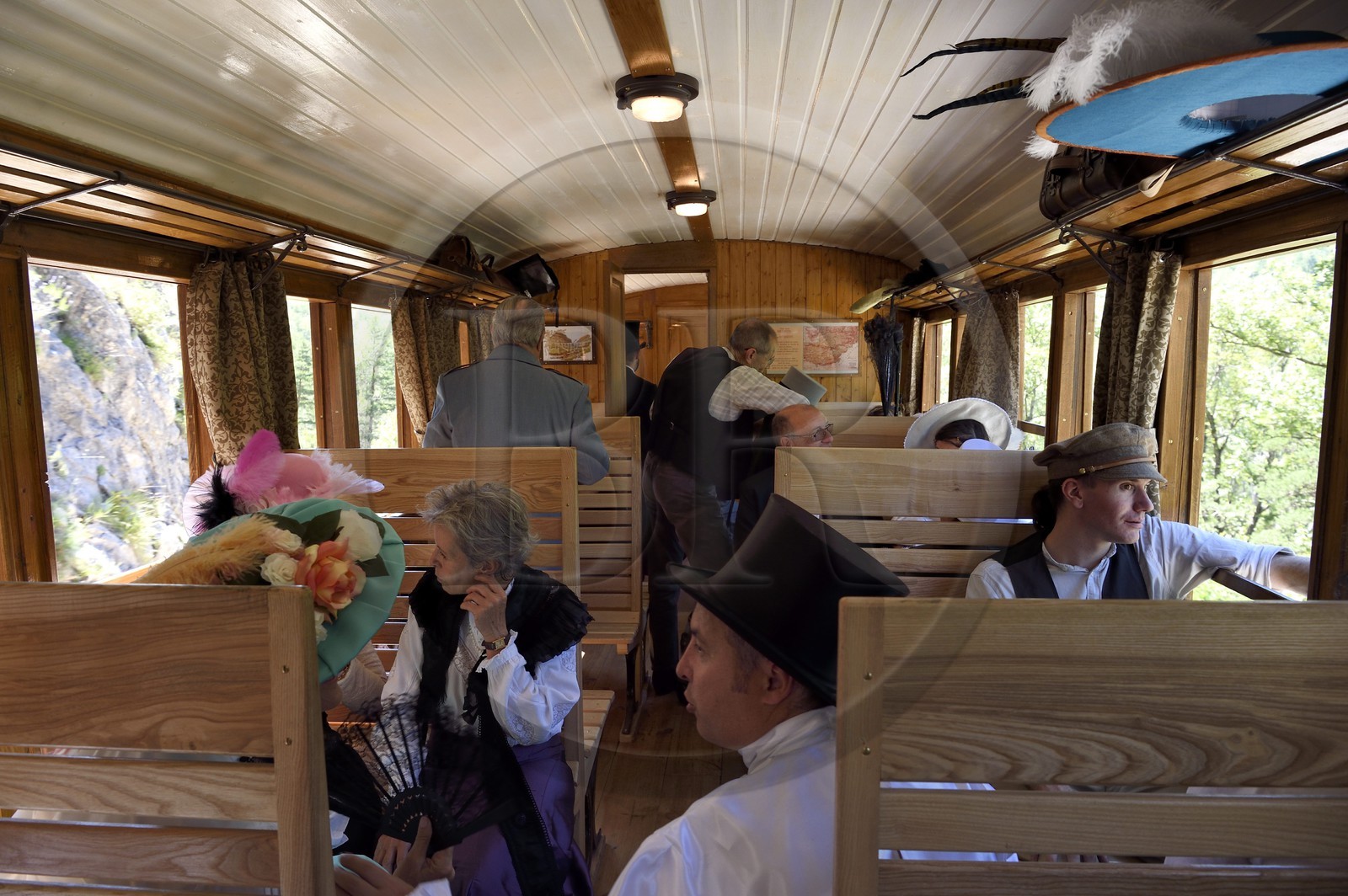 France, Alpes de Haute Provence, between Annot and Saint-Benoit, Train des Pignes historic train, members of the AHVAE (Association d'histoire vivante et de d'archeologie expérimentale) in Belle Epoque costume in a passenger car from 1892