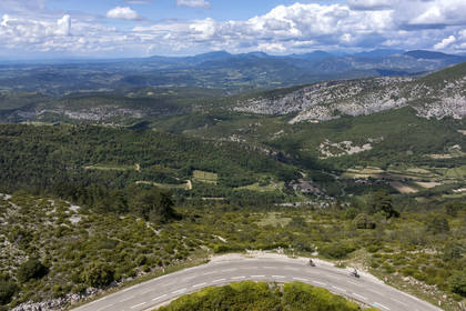 France, Vaucluse, Parc Naturel Regional du Mont Ventoux, Beaumont du Ventoux, D974 road on the northern slope of Mont Ventoux, the Provencal Baronies in the background (aerial view)