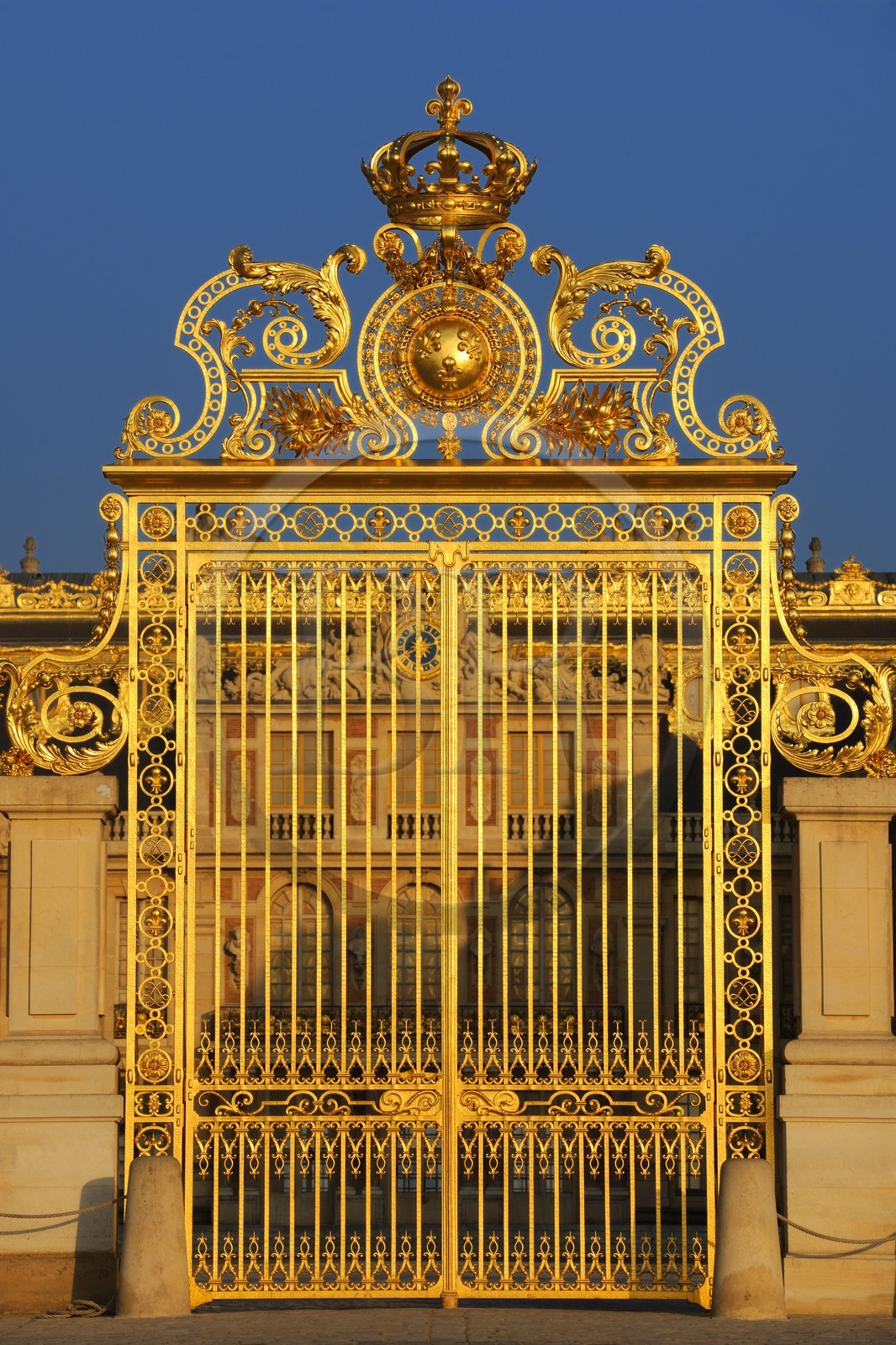 France, Yvelines, Chateau de Versailles, listed as World Heritage by UNESCO, door of the Royal Gate drawn by Mansart (restored in June 2008) which separating the Royal Courtyard